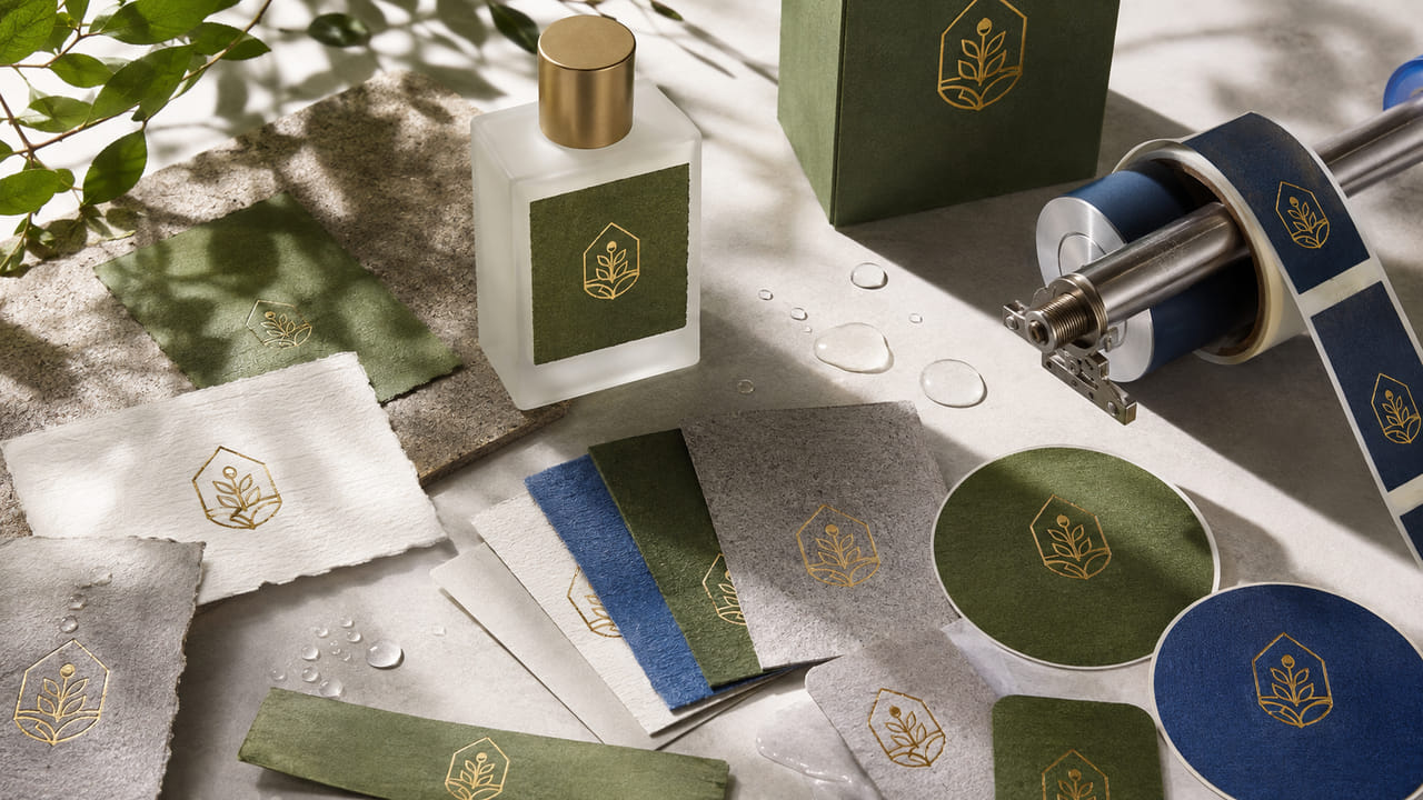 How can buyers choose sustainable-looking perfume labels without weak adhesion for repeat orders?