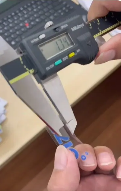 Sticker size checked with a digital caliper