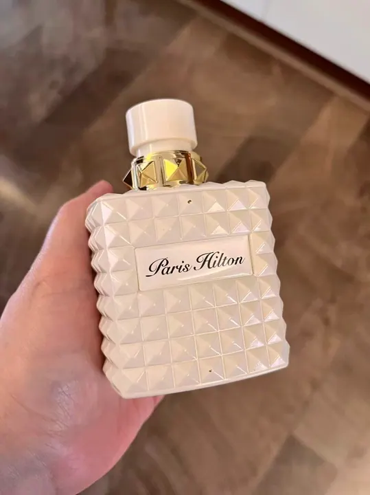 White perfume bottle with resin domed sticker